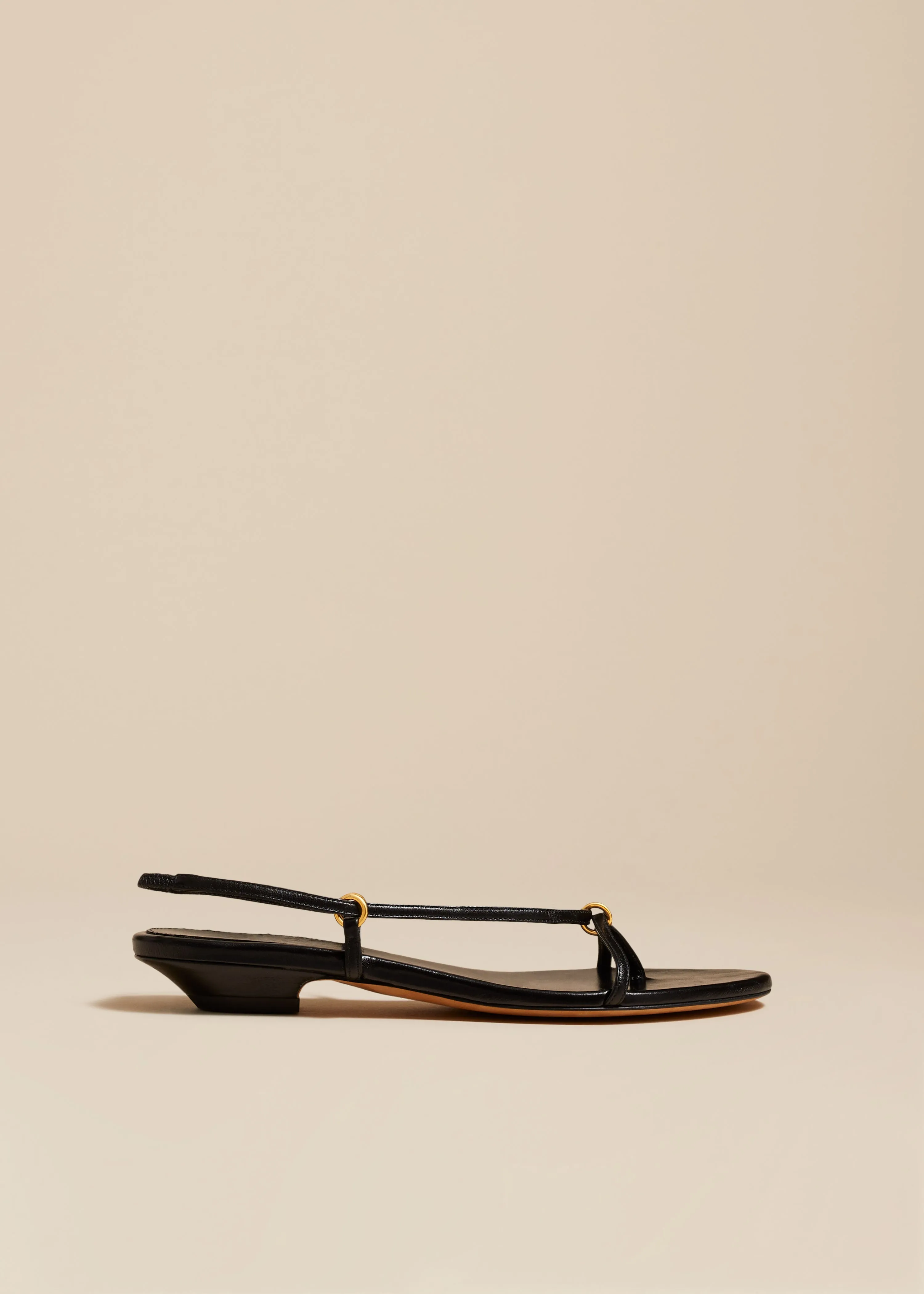 Marion Strappy Flat Sandal in Black Leather sold by KHAITE