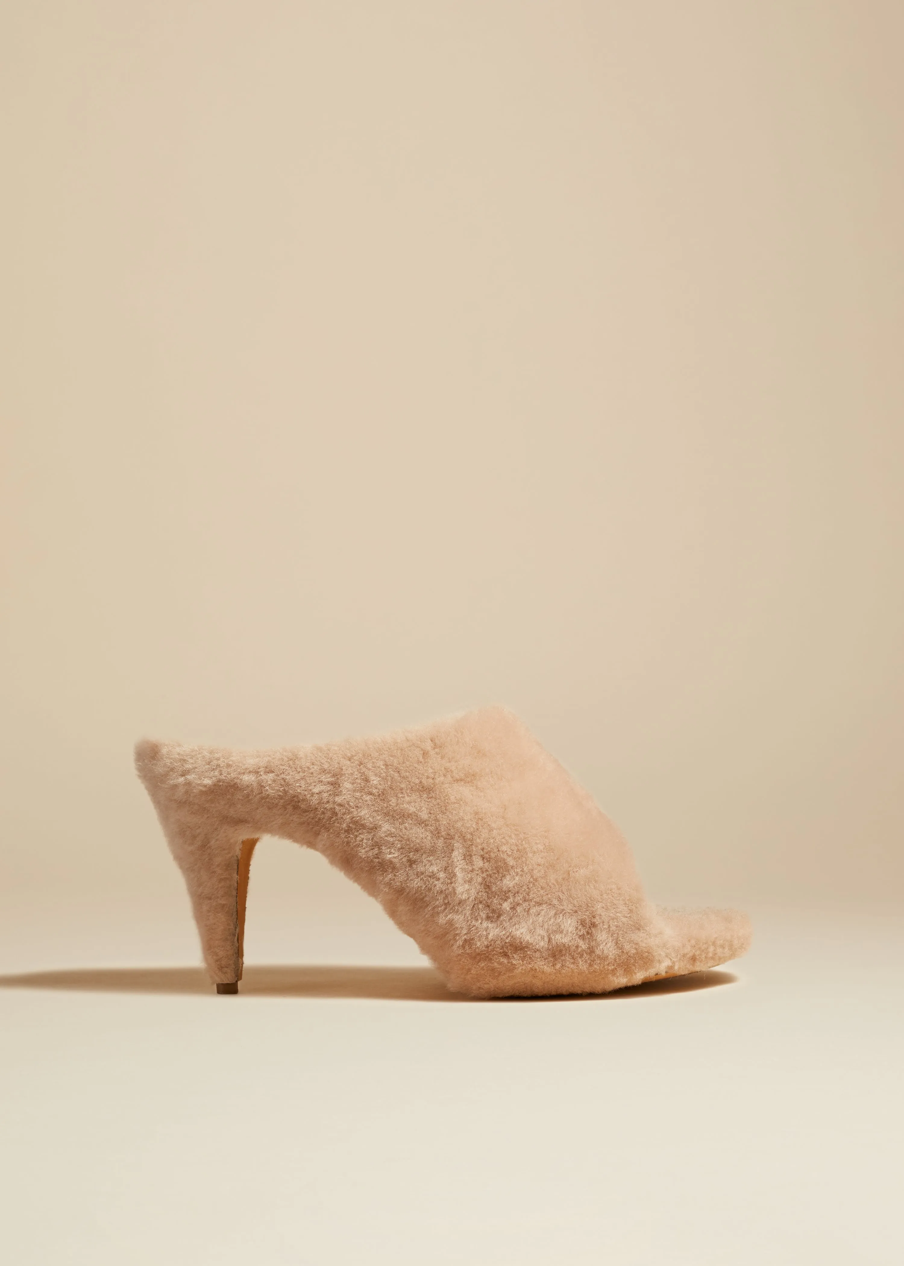 The Marion Mule Sandal in Blush Shearling sold by KHAITE