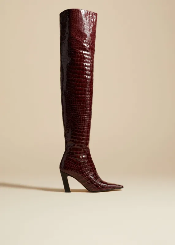 The Marfa Over-the-Knee High Boot in Bordeaux Croc-Embossed Leather Jo sold by KHAITE