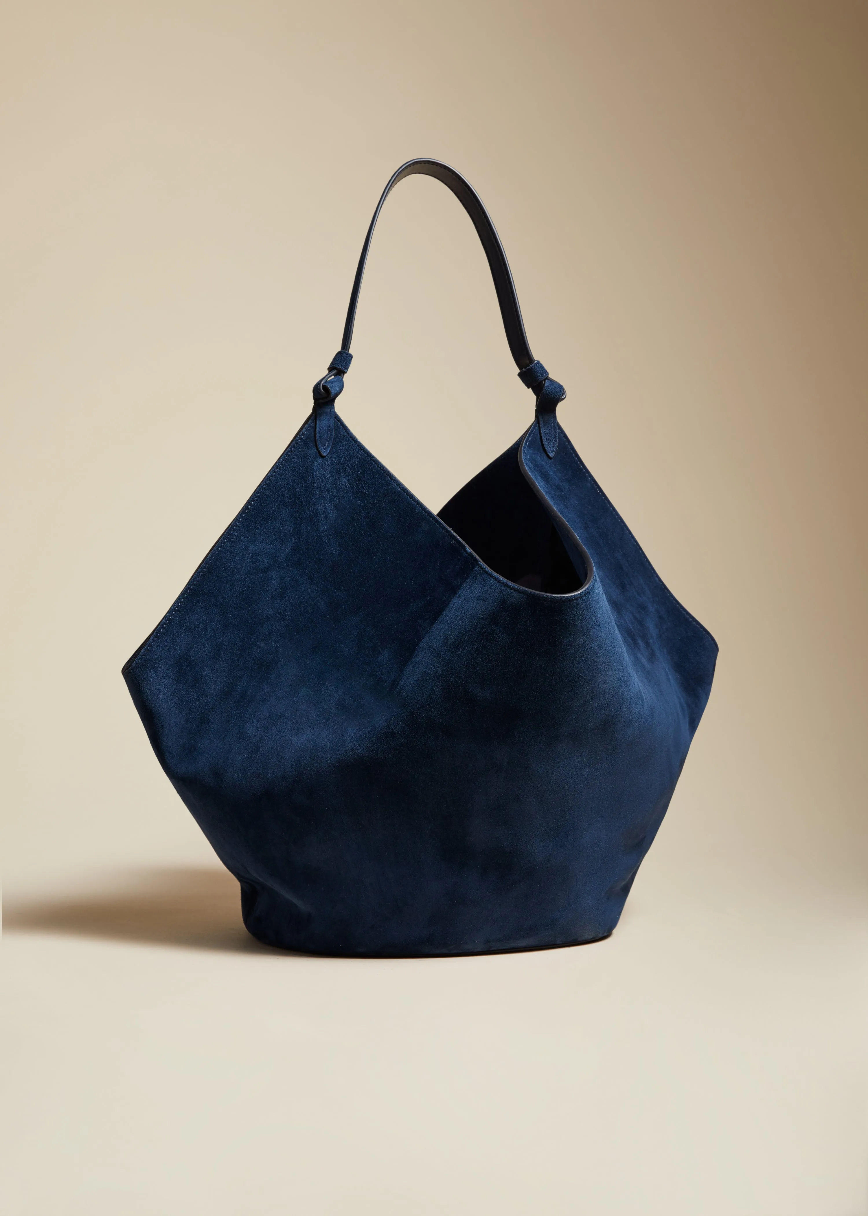 The Medium Lotus Tote in Midnight Suede sold by KHAITE
