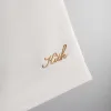 Kith for Olympics Heritage Washed Satin Cedar Short - Sandrift sold by Kith