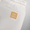 Kith for Olympics Heritage Washed Satin Cedar Short - Sandrift sold by Kith