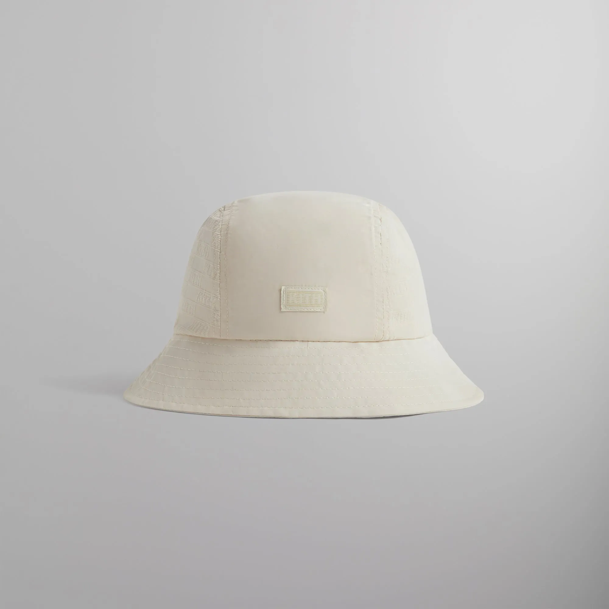 Kith Flocked Nylon Monogram Bucket Hat - Veil sold by Kith