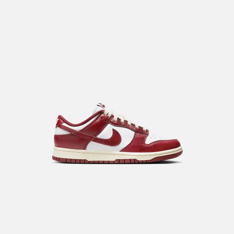 Nike WMNS Dunk Low PRM - White / Team Red / Coconut Milk sold by Kith