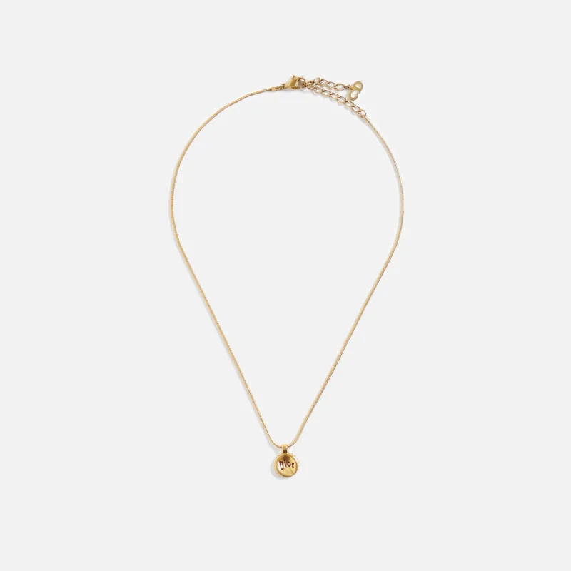 WGACA Dior Logo Medallion Necklace - Gold sold by Kith