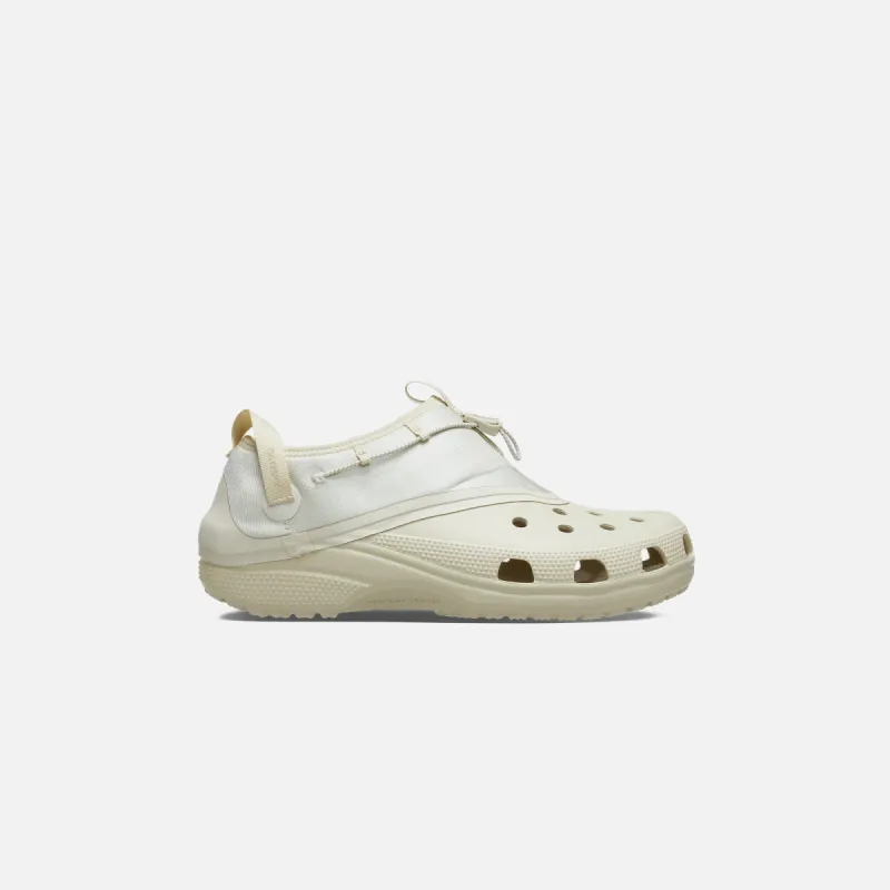 Crocs x Satisfy Classic Croc - Bone sold by Kith
