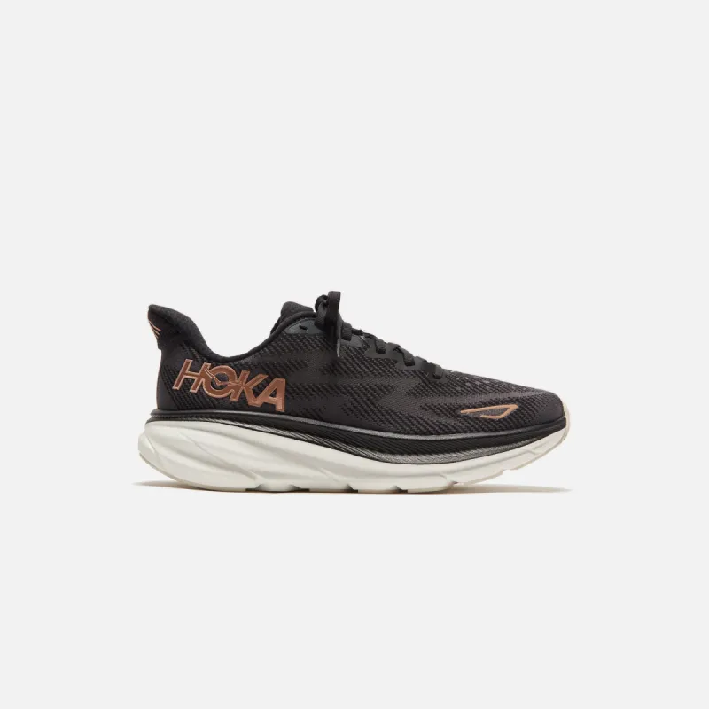 HOKA WMNS Clifton 9 - Black / Rose Gold sold by Kith