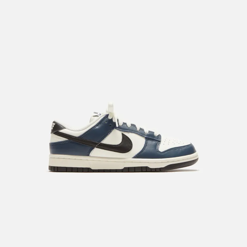 Nike WMNS Dunk Low - Armory Navy / Black / Sail / Coconut Milk sold by Kith