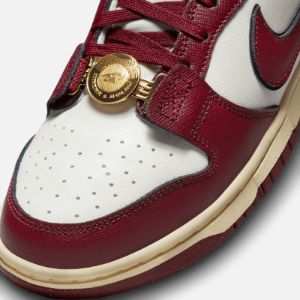 Nike WMNS Dunk Low SE - Sail / Team Red / Black / Muslin sold by Kith