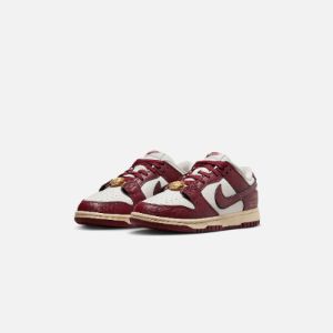 Nike WMNS Dunk Low SE - Sail / Team Red / Black / Muslin sold by Kith