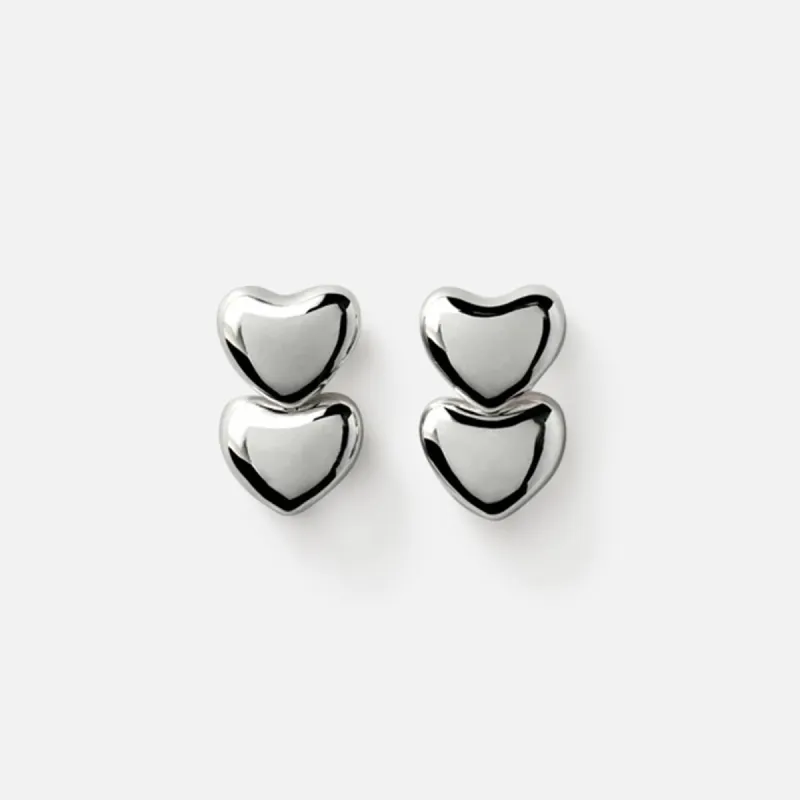 Annika Inez Dual Voluptuous Heart Earrings - Silver sold by Kith