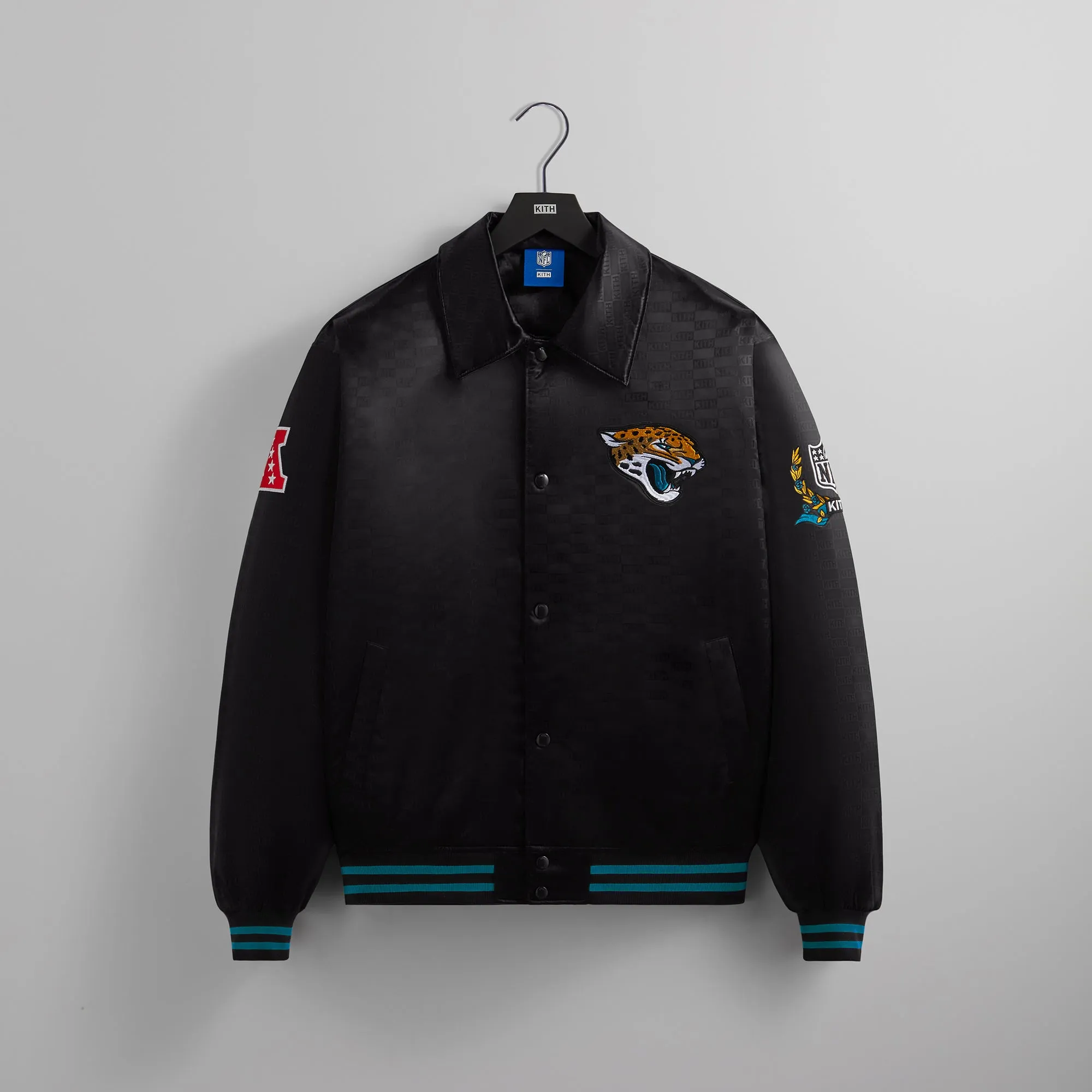 Kith for the NFL: Jaguars Satin Bomber Jacket - Black sold by Kith