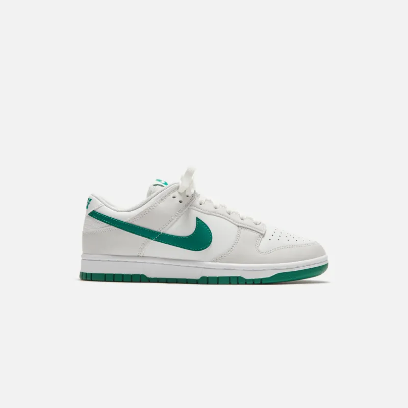 Nike Dunk Low Retro - Summit White / Malachite / Platinum sold by Kith