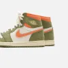 Nike Air Jordan 1 Retro High OG Craft - Celadon / Sky J Light Olive / Bright Mandarin / Coconut Milk / Pale Ivory sold by Kith