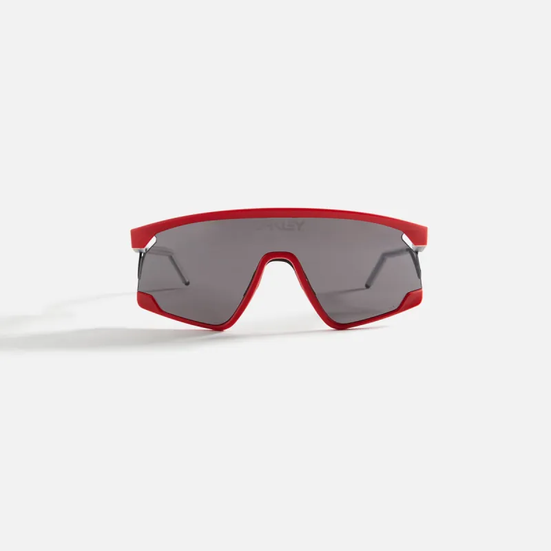 Oakley x Sunset BXTR Metal FP Matte Redline - Prizm Grey sold by Kith