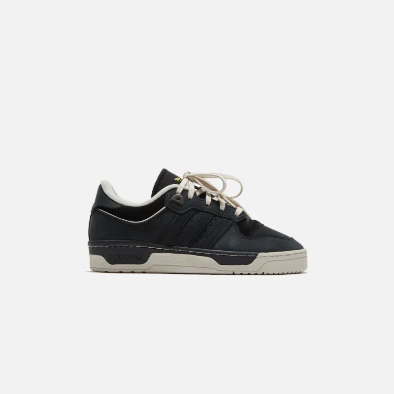 adidas Rivalry 86 Low 2.5 - Core Black / Talc / Cream White sold by Kith