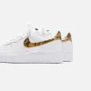 Nike Air Force 1 Low - White / Elemental Gold / Dark Haze sold by Kith