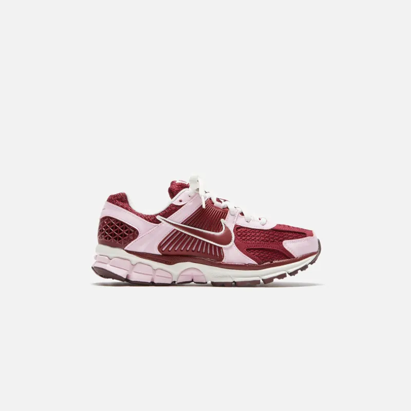 Nike WMNS Zoom Vomero 5 - Pink Foam / Rush Fuchsia / Sail / Team Red sold by Kith