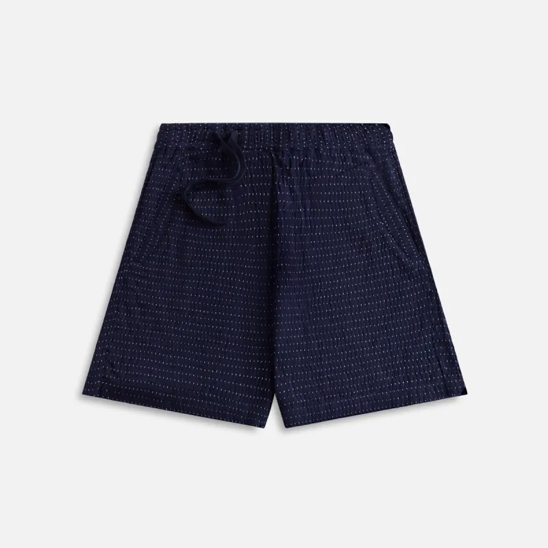 Maharishi Noragi Loose Asymmetrical Track Short - Indigo sold by Kith