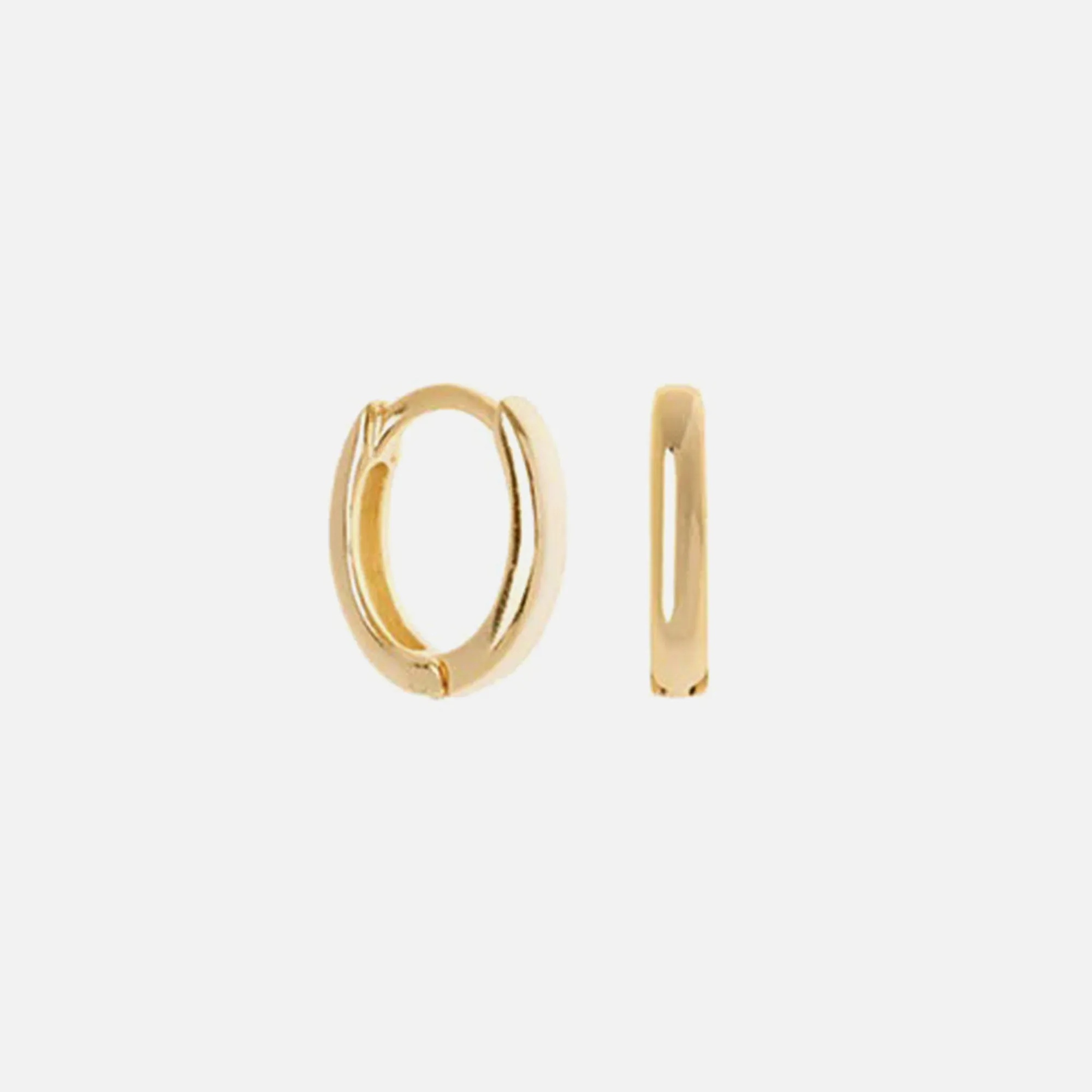 SHASHI Katerina Huggie Hoop - Gold / Clear sold by Kith