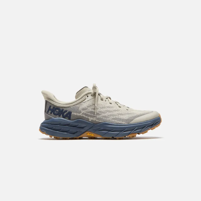 HOKA Speedgoat 5 - Farro / Varisty Navy sold by Kith
