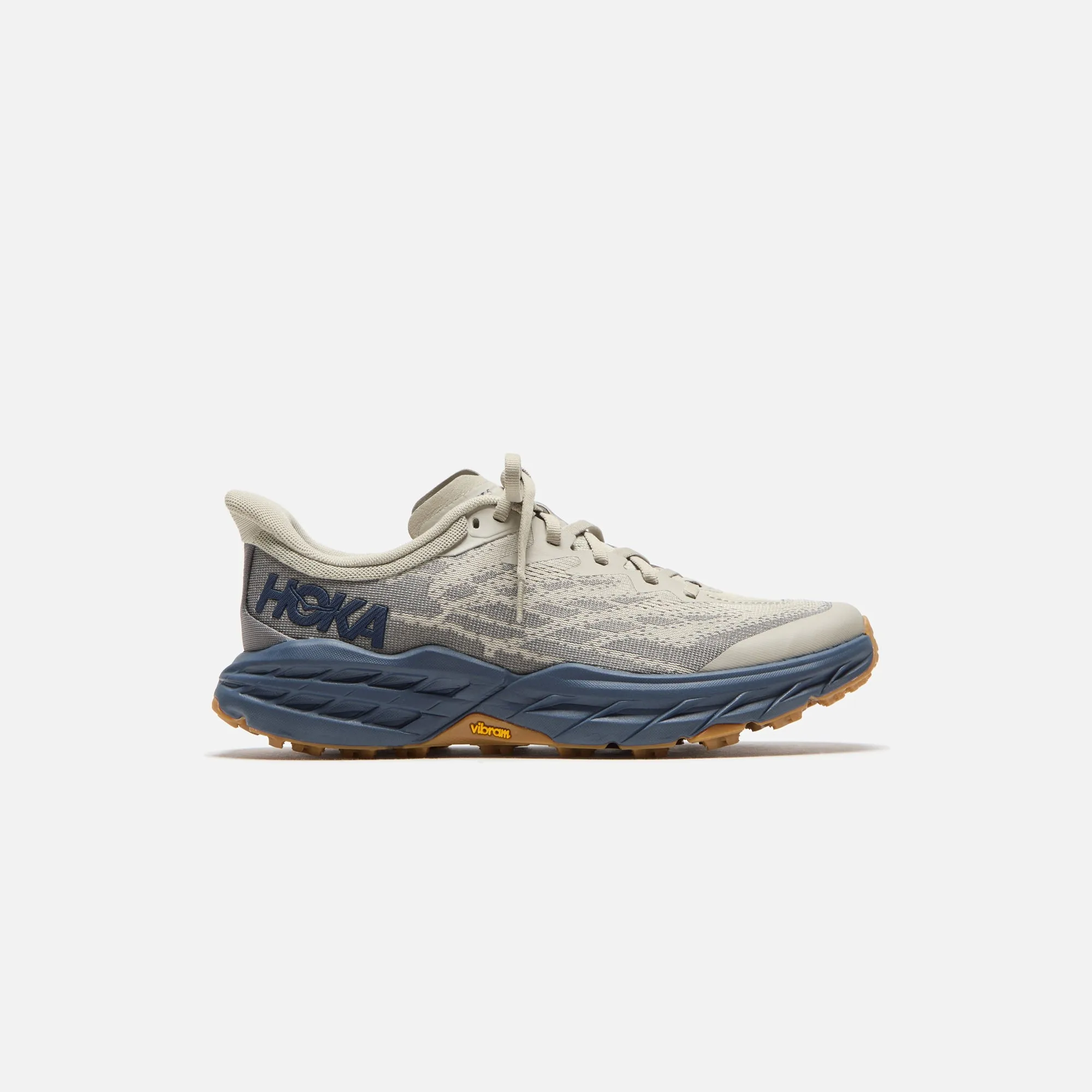 HOKA Speedgoat 5 - Farro / Varisty Navy sold by Kith