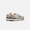 Nike WMNS P-6000 - Coconut Milk / Black / Summit White sold by Kith