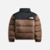 The North Face 1996 Retro Nuptse Jacket - Smokey Brown / TNF Black sold by Kith