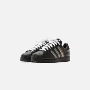 adidas x Pleasures Superstar - Core Black / Red sold by Kith