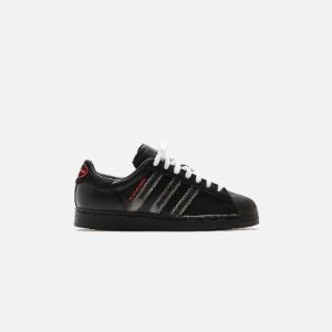 adidas x Pleasures Superstar - Core Black / Red sold by Kith