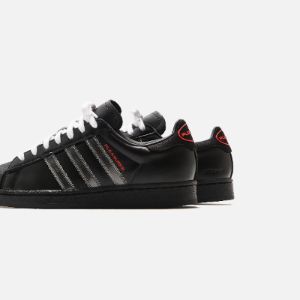 adidas x Pleasures Superstar - Core Black / Red sold by Kith