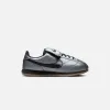 Nike Cortez Leather SE - Metallic Cool Grey / Black / Gum Dark Brown sold by Kith