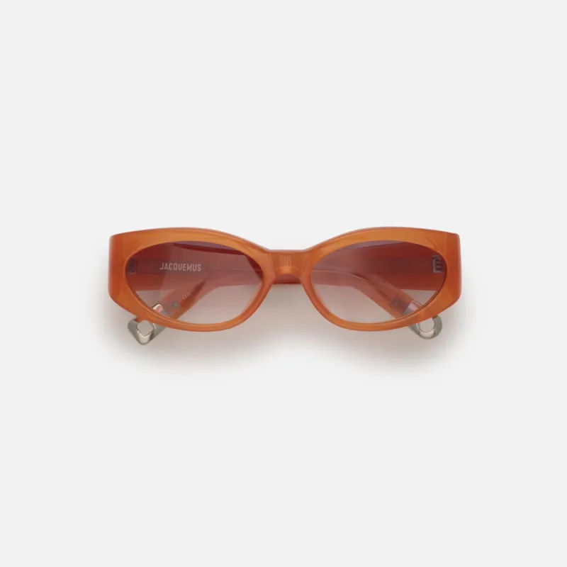 Jacquemus Ovalo Sunglasses - Milky Amber sold by Kith