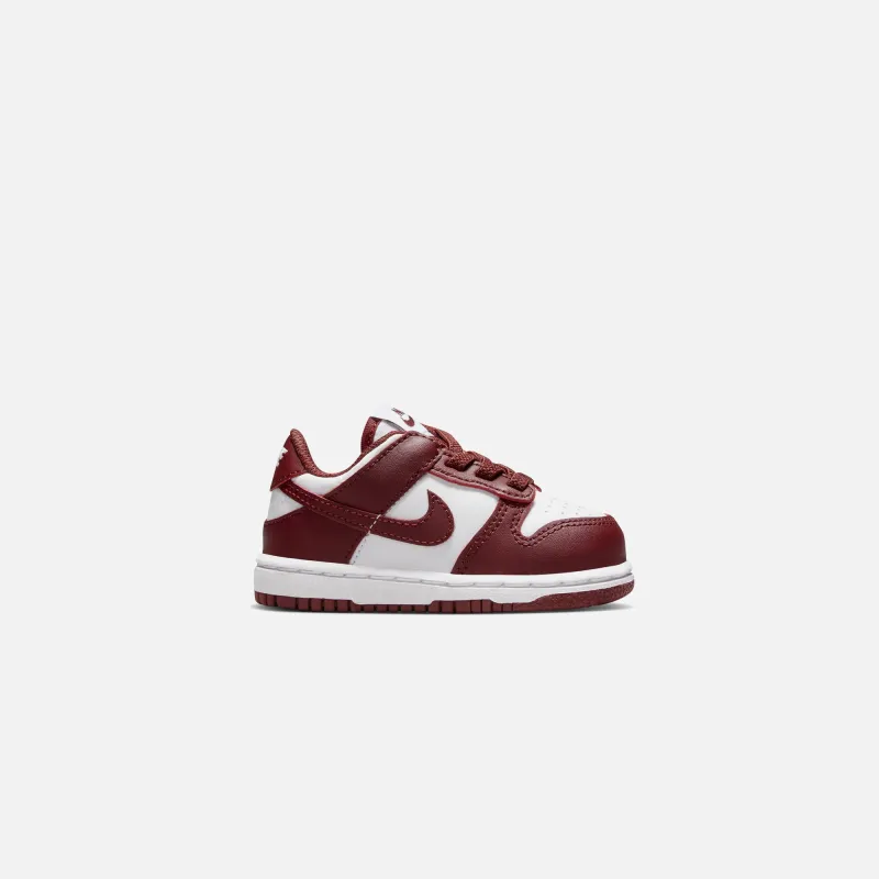 Nike TD Dunk Low - White / Redwood / Gym Red sold by Kith