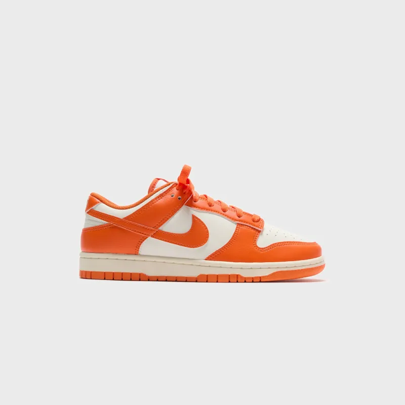Nike Dunk Low Retro - Pale Ivory / Safety Orange sold by Kith