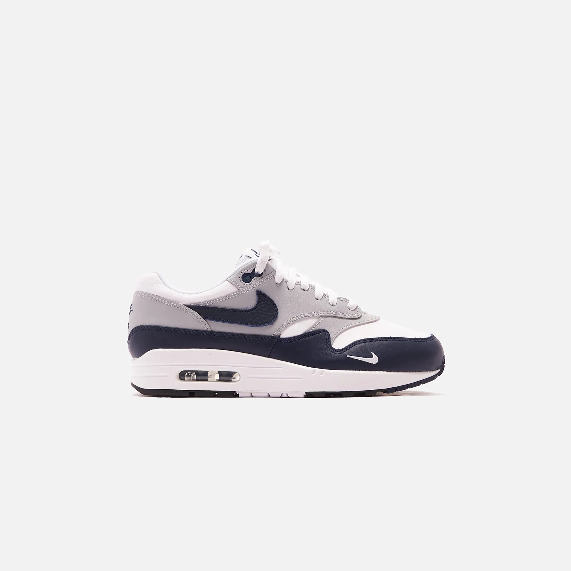 Nike Air Max 1 LV8 - White / Obsidian / Wolf Grey / Black sold by Kith