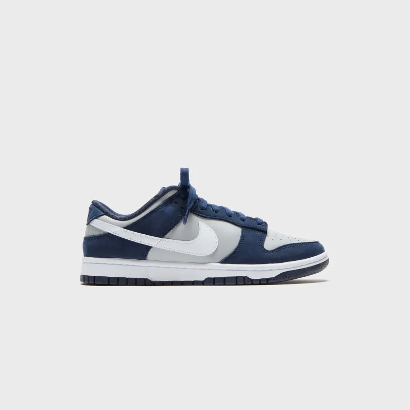 Nike Dunk Low - Obsidian / White / Light Smoke Grey sold by Kith