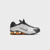 Nike Shox R4 - Black / Vast Grey / Bright Mandarin / Metallic Silver sold by Kith