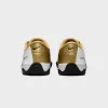Nike T90 SP - White / Black / Metallic Gold sold by Kith
