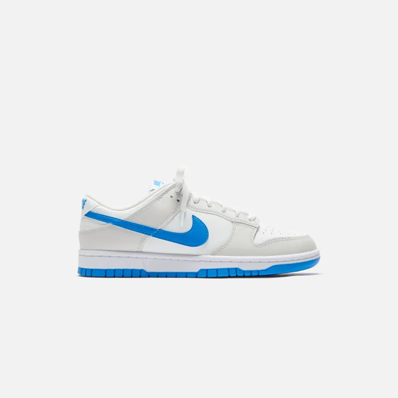 Nike Dunk Low Retro - Summit White / Photo Blue sold by Kith
