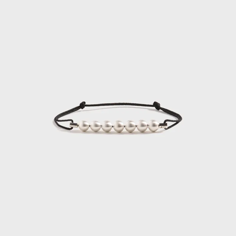 Le Gramme 13G Sterling Silver 7 Beads Cord Bracelet - Black sold by Kith