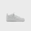 Nike Air Force 1 Low - Summit White / Light Orewood Brown sold by Kith