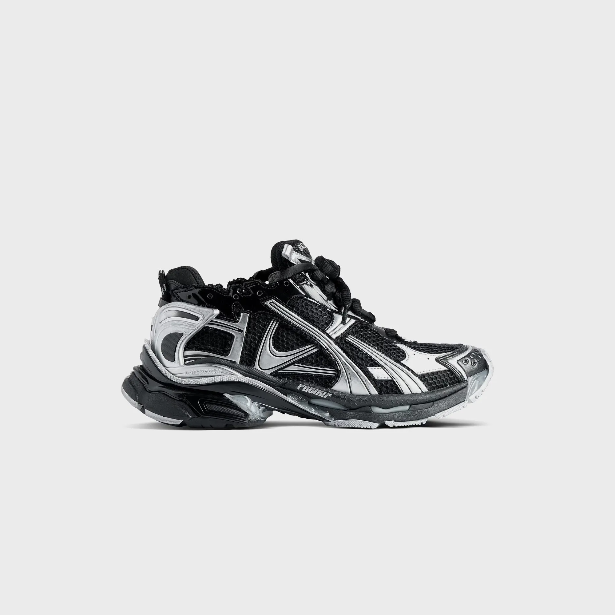 Balenciaga Runner - Black / Silver sold by Kith