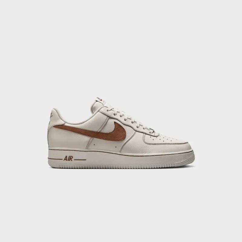 Nike Air Force 1 '07 LV8 - Ivory / Saddle Brown sold by Kith