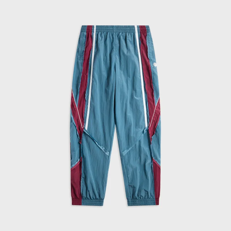 Martine Rose Panelled Track Pant - Blue Teal sold by Kith