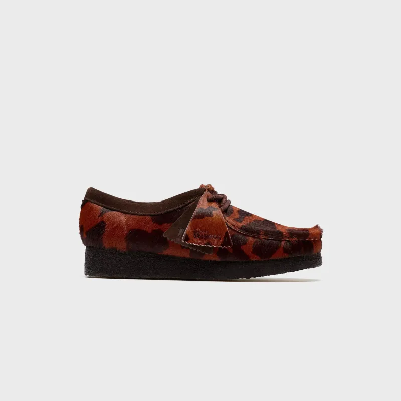 Clarks WMNS Wallabee - Brown Cow Print sold by Kith