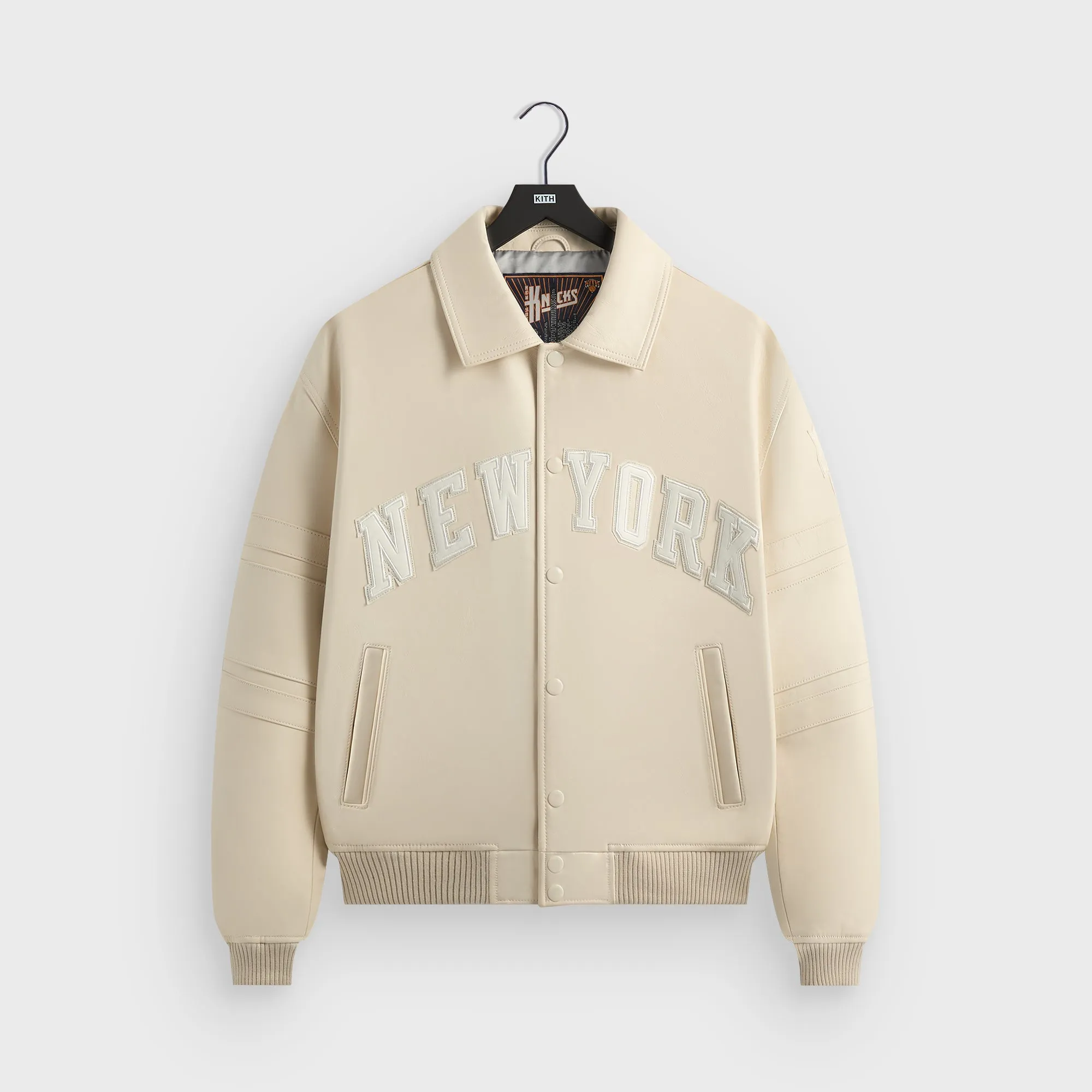 Kith & AVIREX for the New York Knicks Patrick Ewing Legend Jacket - Sandrift sold by Kith