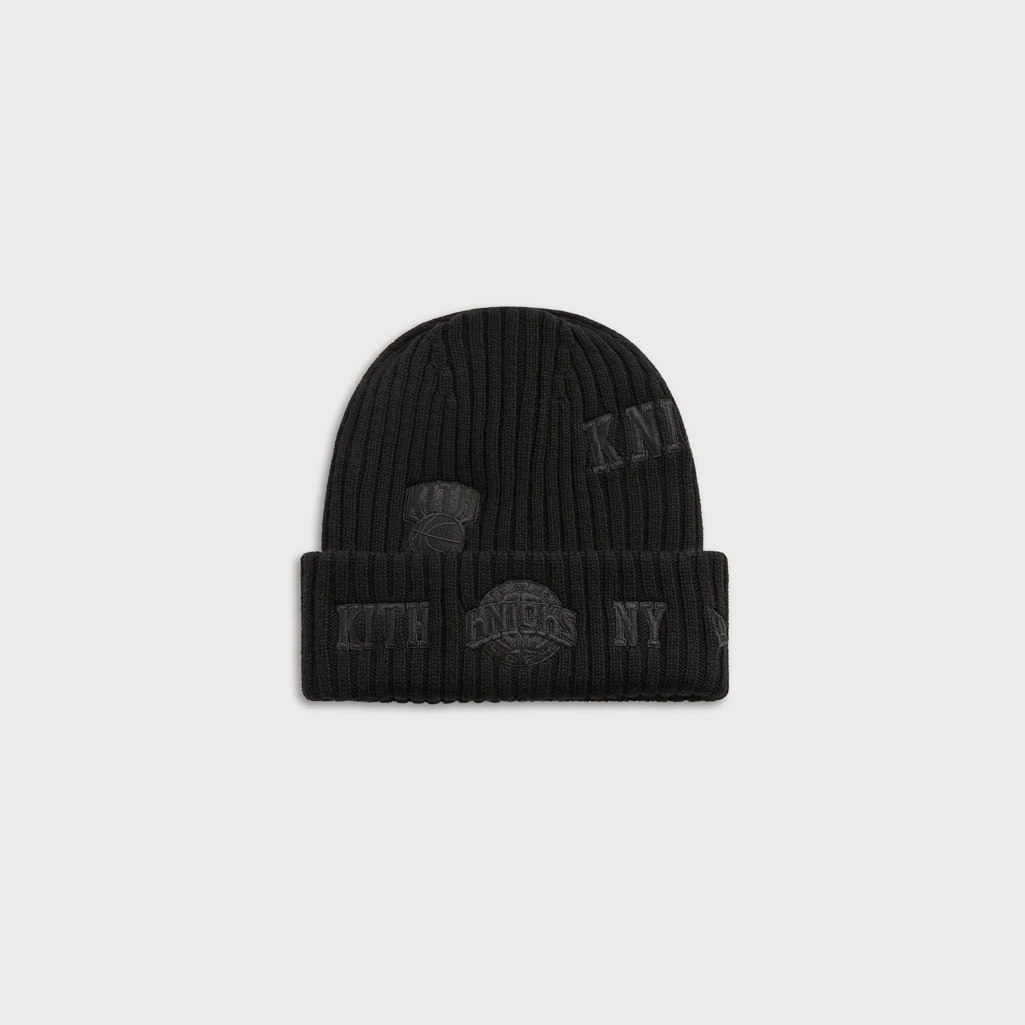 Kith & New Era for the New York Knicks All Over Patches Knit Beanie - Black sold by Kith