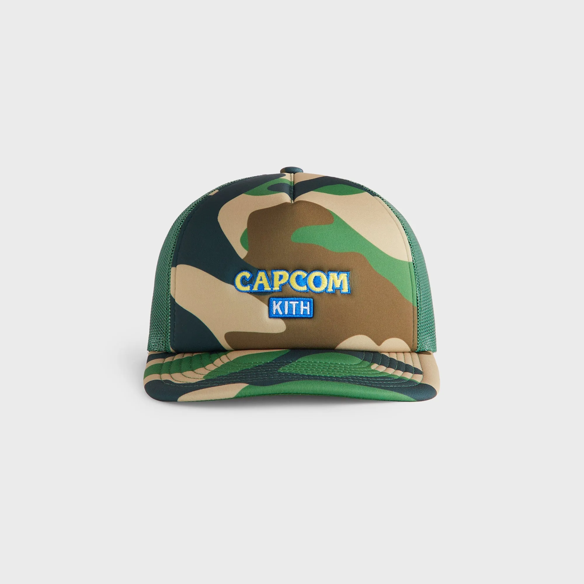 Capcom | Kith Camo Nolan Trucker Hat - Camo sold by Kith