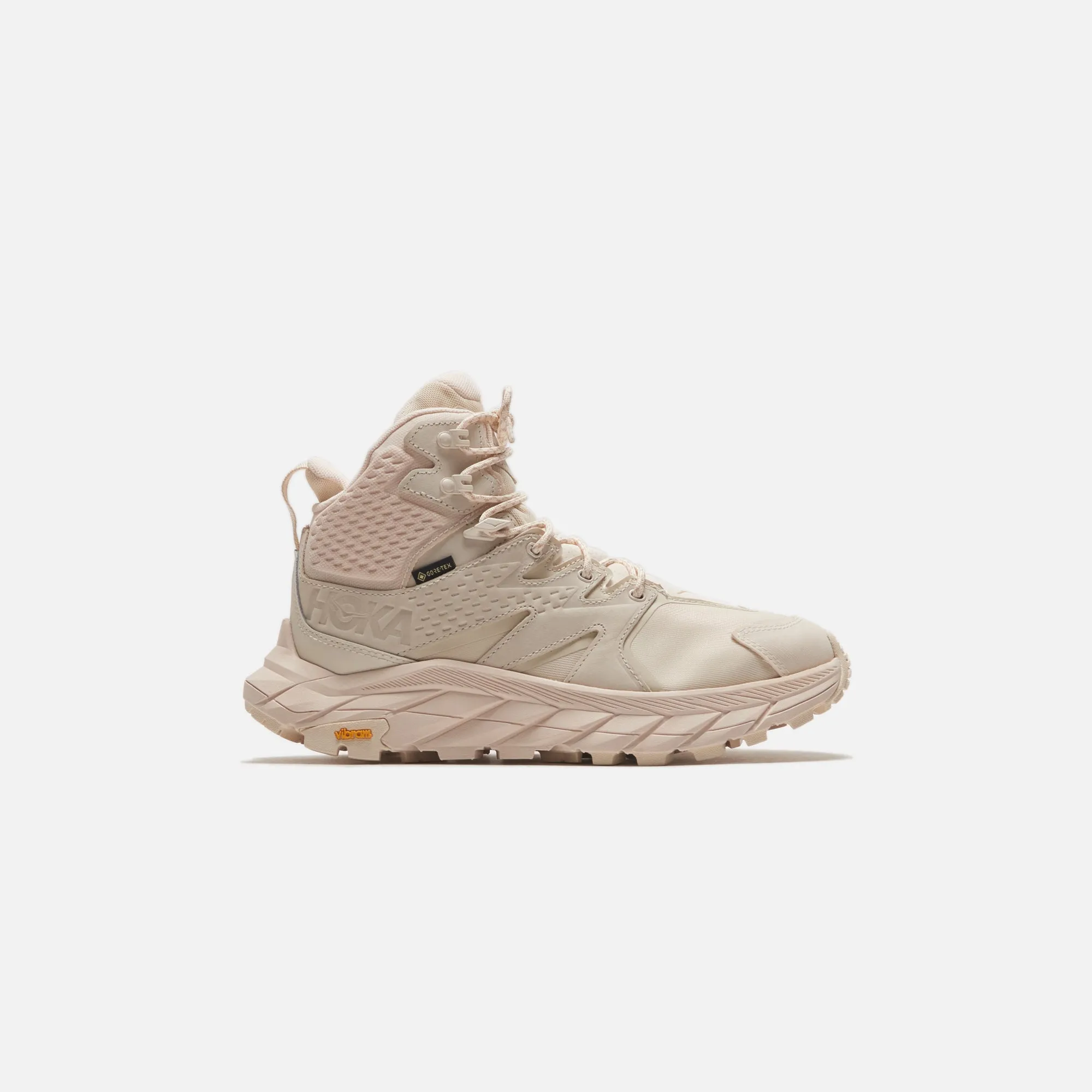 Hoka WMNS Anacapa Mid GTX - Eggnog / Shifting Sand sold by Kith